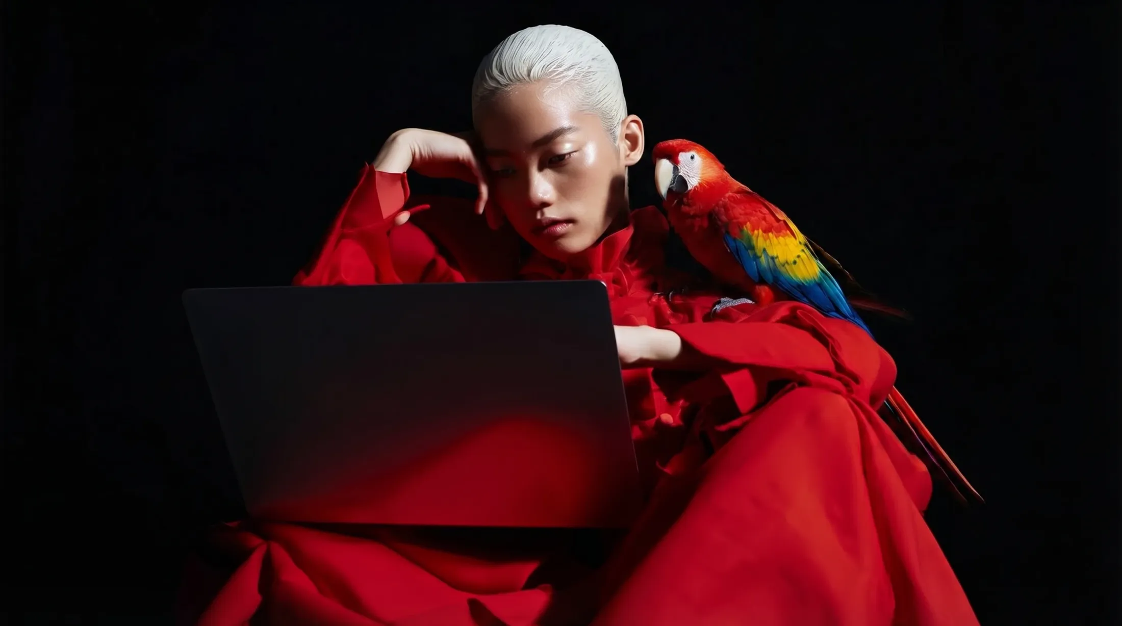 Editorial portrait from the Social Edge brand campaign — bold red styling on black